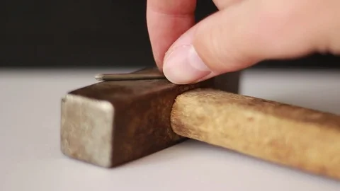 Putting nail on hammer Vídeo Stock 75827301