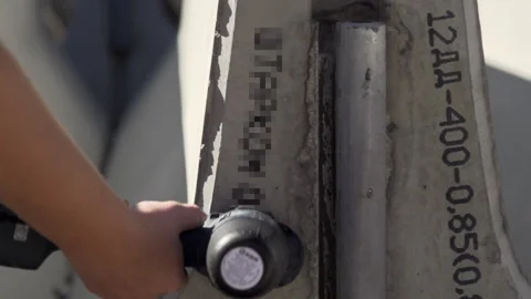 Putting a name on the barrier Stock Footage 263967784