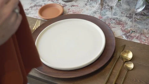 Putting Napkin on Plate at Dinner Table / Wedding Reception Decor Stock Footage 121010042