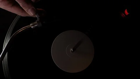 Putting The Needle On A Vinyl Record, Moving Light and Slow Motion. Stock Footage 104754395