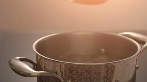 Putting nest pasta in to the pan with boiling water Stock Footage 67994603