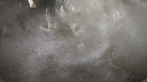 Putting noodles to cook. Stock Footage 149154077