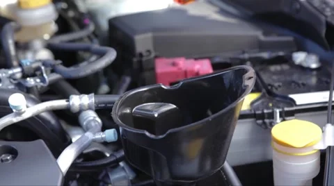 Putting oil in car Stock Footage 46178801