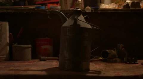 Putting old oil can on workbench - Graded image Stock Footage 67451277