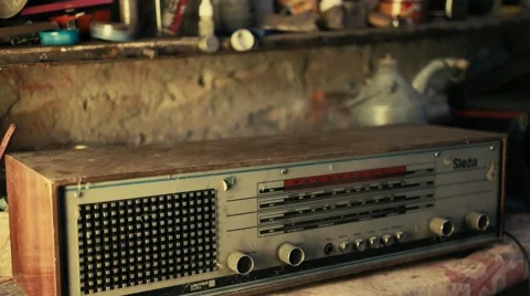 Putting old radio on workbench - Graded image Stock Footage 67452019
