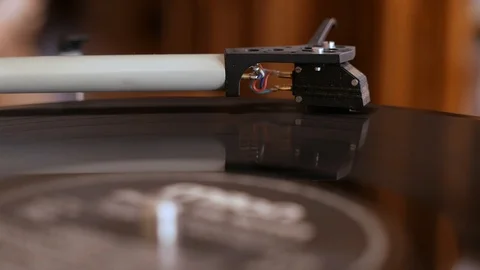 Putting an old vinyl record Stock Footage 108136780
