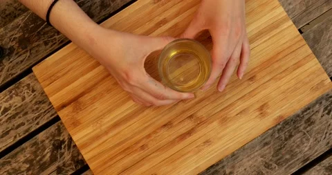 Putting olive oil on a work kitchen surface Video stock 130742271