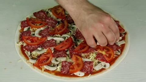 Putting olives on a pizza Stock Footage 52487848