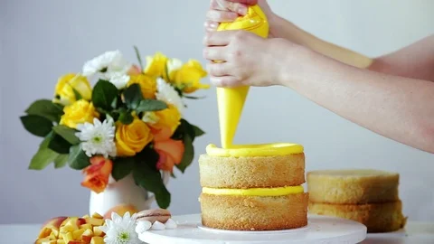 Putting one cake layer on the other and than making cream Stock Footage 102042867