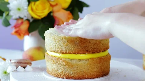 Putting one cake layer on the other. Stock Footage 102042953