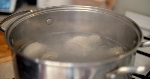 Putting onion to chicken soup Stock Footage 87862450