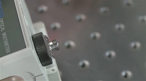 Putting optical fiber cable in machine for testing Stock Footage 56938135