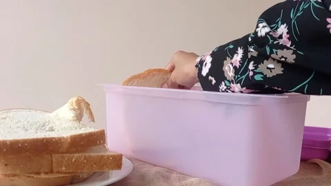 Putting oranges into a brown table Stock Footage 146256946