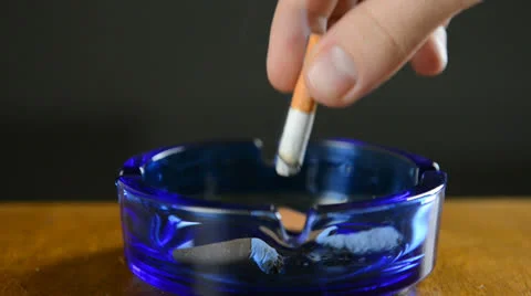 Putting out a cigarette Stock Footage 22770983