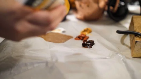 Putting Paint on Easel Stock Footage 91337615