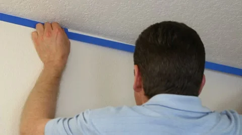 Putting on Painter's Tape Stock Footage 10714644