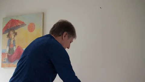 Putting painting on the wall (variant three). Stock-Footage 151130982