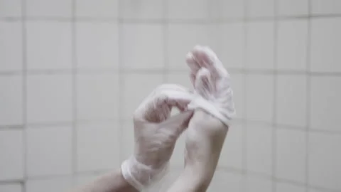 Putting on a pair of Latex Gloves Stock Footage 162282998