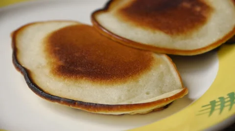 Putting Pancake On The Plate Stock Footage 65402864
