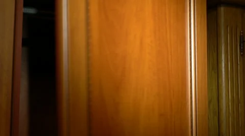 Putting pants into a wardrobe Stock Footage 61441201