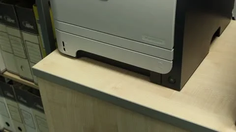 Putting paper in office printer Stock Footage 10841070