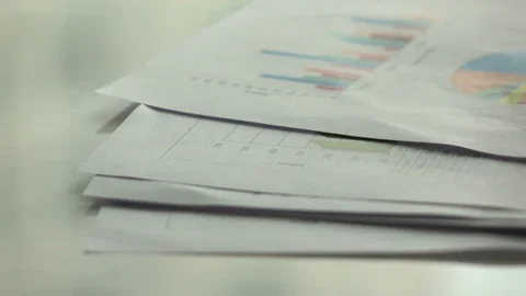 Putting paperwork on desk in office with slow motion. Stock Footage 83160645
