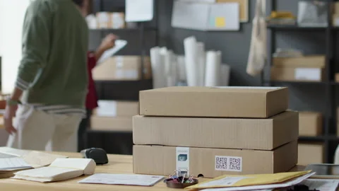 Putting Parcels on Table in Delivery Service Office 스톡 동영상 228488625