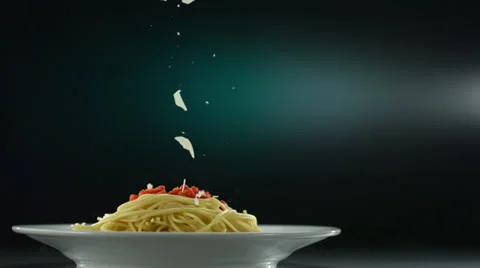 Putting parmesan chese on spaghetti, Slow Motion Stock Footage 31819421