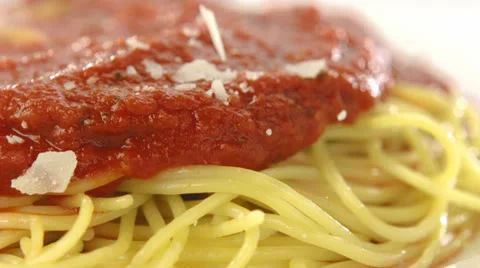 Putting parmesan chese on spaghetti, Slow Motion Stock Footage 31819511