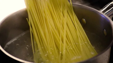 Putting Pasta into Boiling Water Stock Footage 49290681
