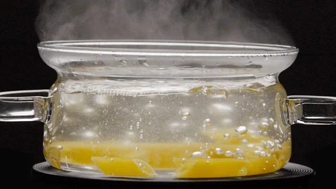 Putting pasta fusilli into a pot of boiling water Stock Footage 108113780