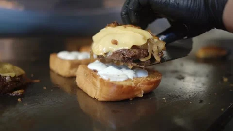 Putting A Patty With Cheese On The Bread Stock Footage 197056528