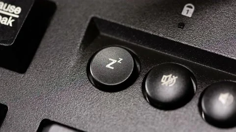 Putting PC to sleep, pressing sleep button on a black desktop computer keyboard 스톡 동영상 143789777
