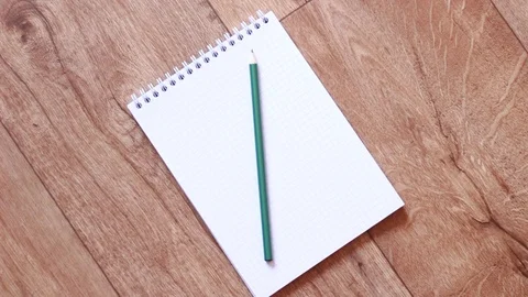 Putting pencil on notebook and taking it back Vídeos de archivo 94440344