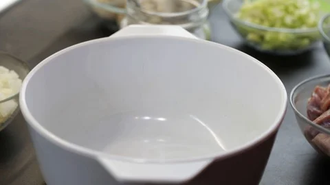 Putting pieces of beef in the pot Stock Footage 121120492