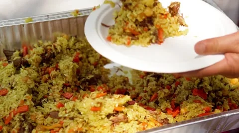 Putting pilaf. Stock Footage 49760578