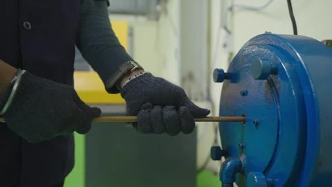 Putting Pipe Brass Copper Rod inside Machine  Stock Footage 322114929