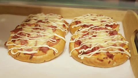 Putting pizza on the bakery window Stock Footage 146574150