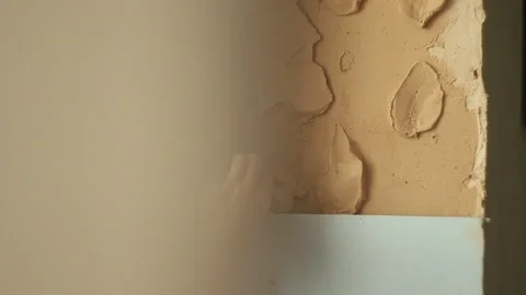 Putting plaster on a wall. building wall finish. apartment renovation Stock Footage 106355936