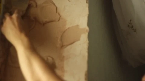 Putting plaster on a wall. building wall finish. apartment renovation Stock Footage 106356254