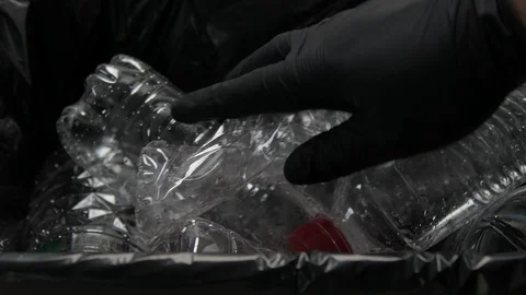 Putting Plastic Bottle In garbage Video stock 103154017