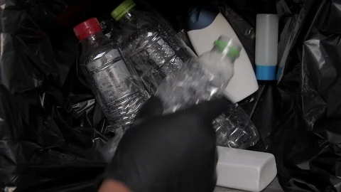 Putting Plastic Bottle In garbage Video stock 103154083
