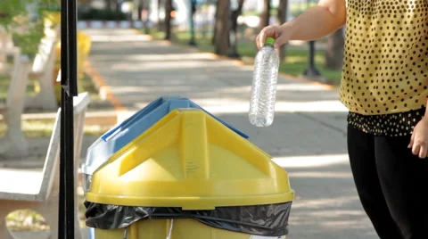 Putting plastic bottles in recycle container. Stock Footage 41311979