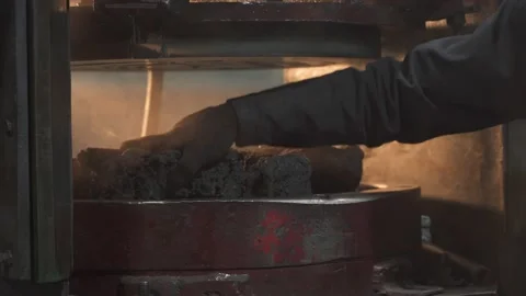 Putting plastic into a mold press at the factory Stock Footage 164516733