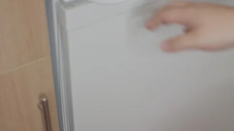 Putting A Plastic Tupperware Box Into A Fridge Stock Footage 95681038