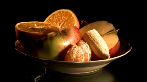 Putting plate with fruit on a table Stock Footage 8841319