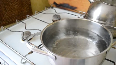 Putting potato pieces into pot with boiling water Stock Footage 67308076