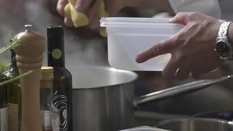 Putting potatoes in a pot Stock Footage 82028154