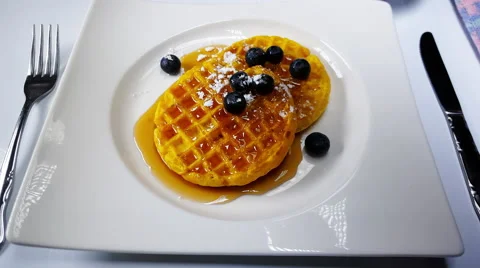 Putting Powdered Sugar on Waffles 4K Stock Footage 58065701