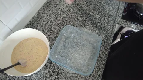 Before putting the prepared raw cake ingredients into the baking dish. Stock Footage 234784482